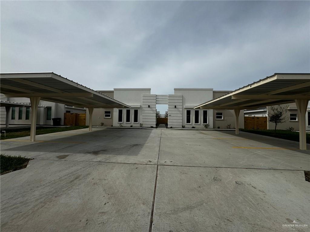 a front view of a house with a street