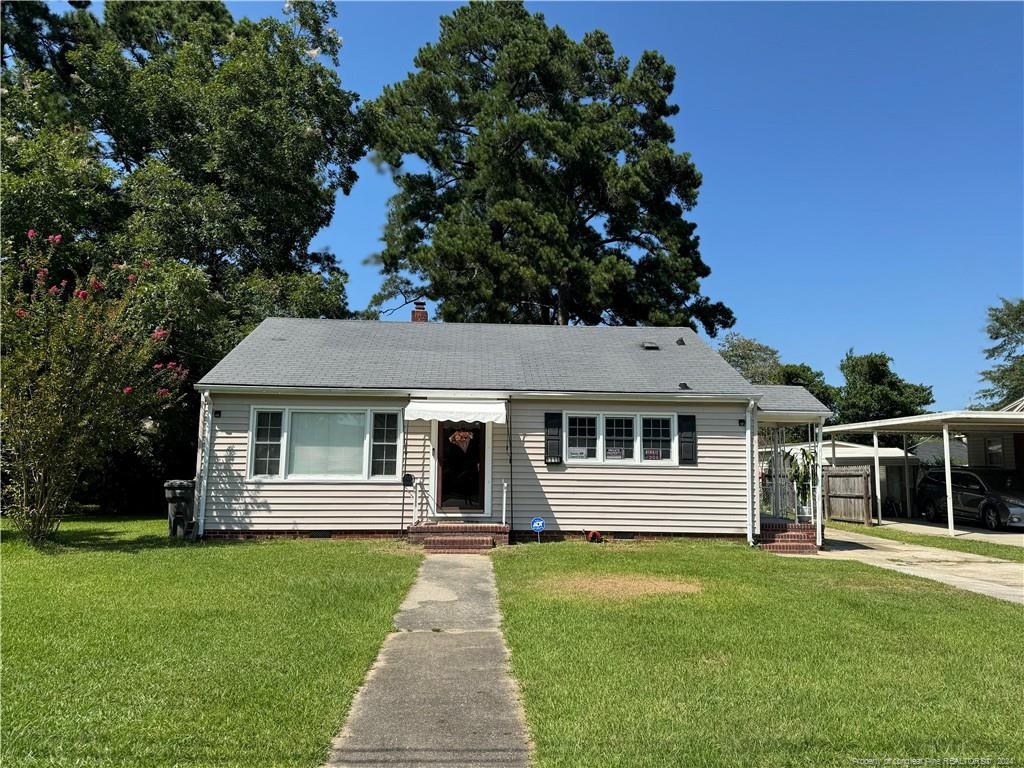 front view of a house with a yard