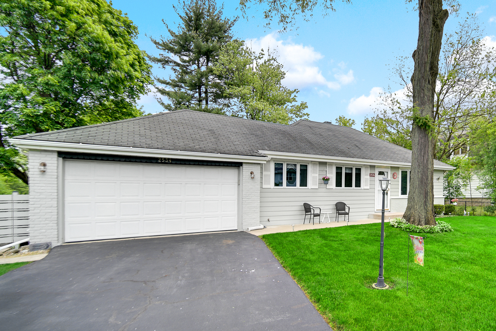 a front view of house with yard and green space