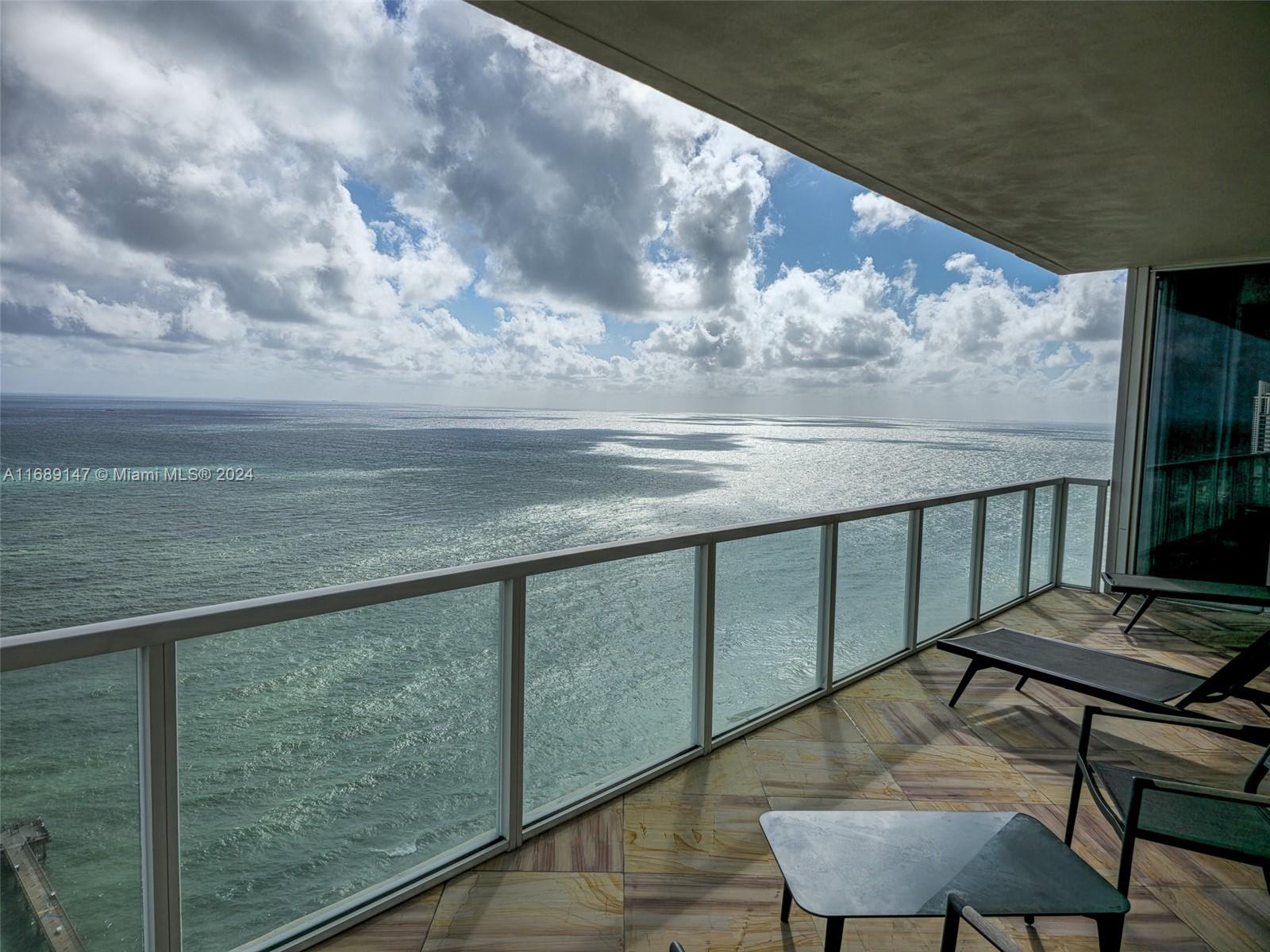 a view of swimming pool from a balcony