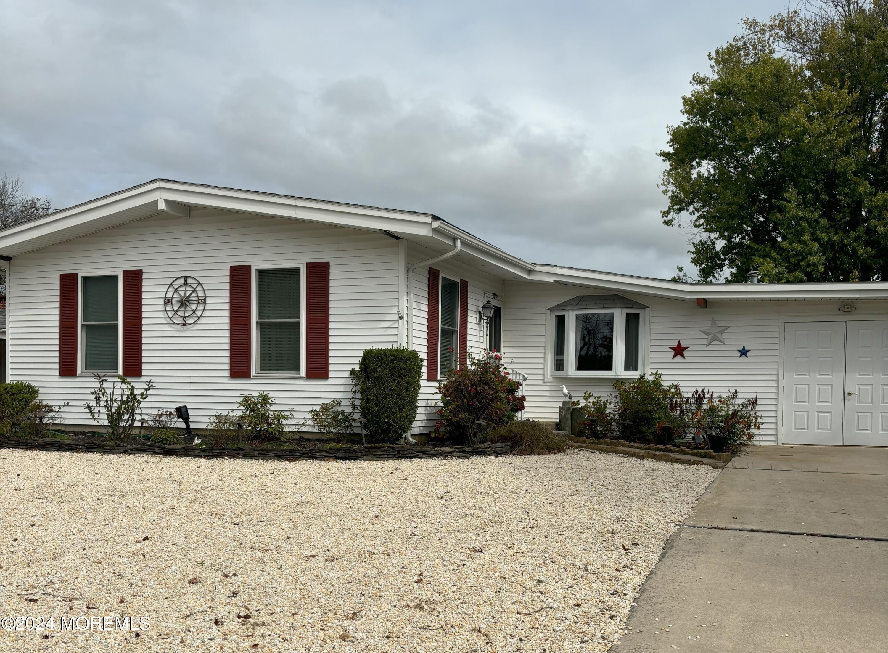 a front view of a house with yard