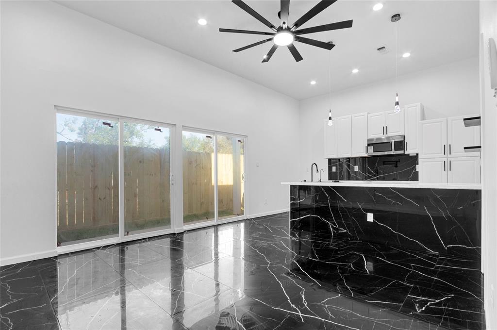 a kitchen with a refrigerator and a sink