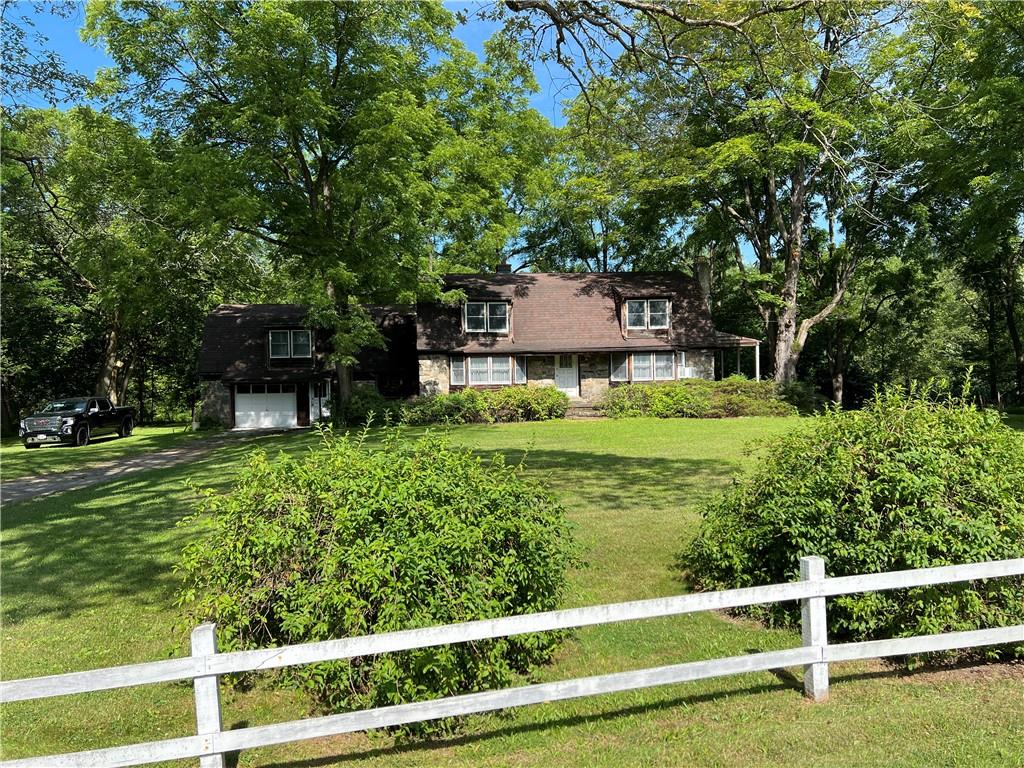 View of yard with a garage