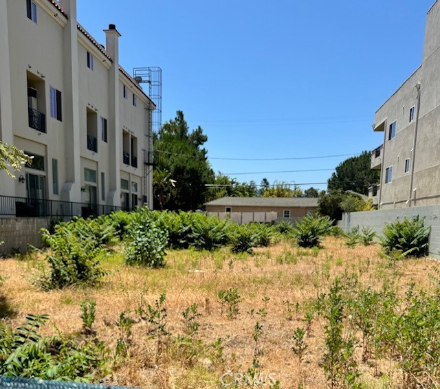 a view of a street with a building in the background