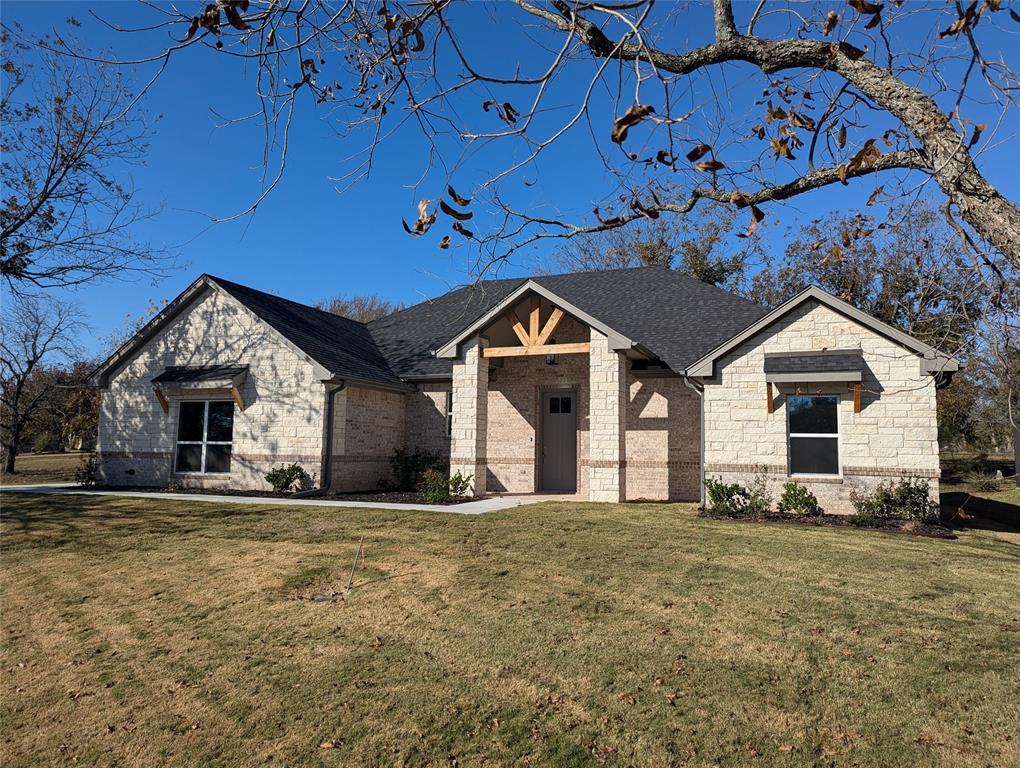 a front view of a house with a yard