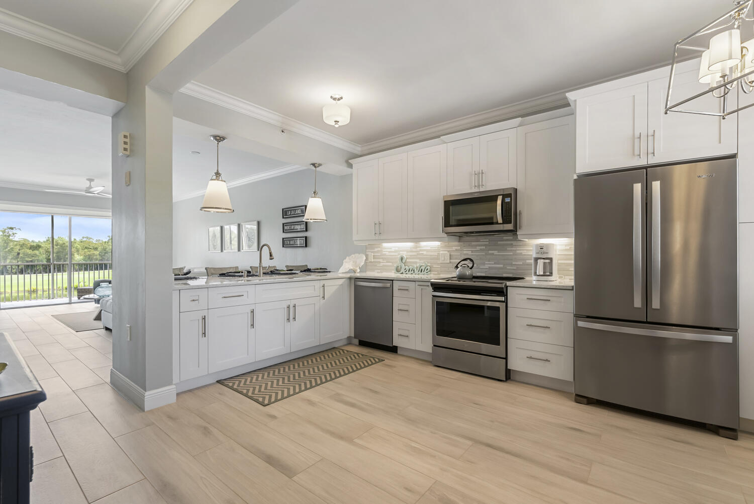 a kitchen with a refrigerator stove and sink