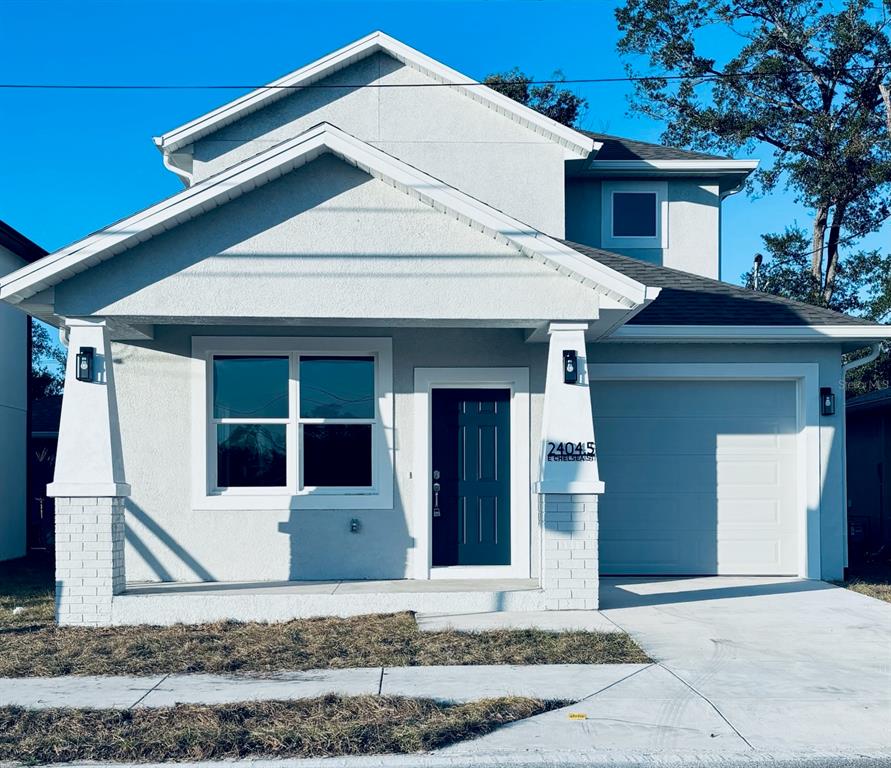 a front view of a house with a garage