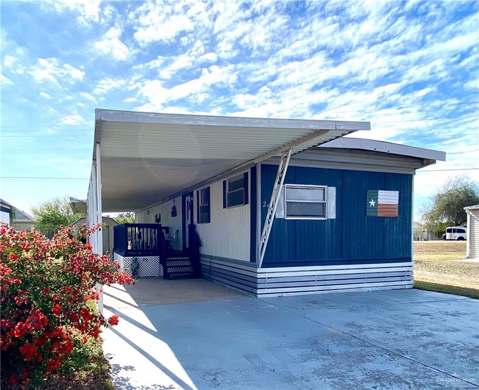 View of home's exterior featuring a carport