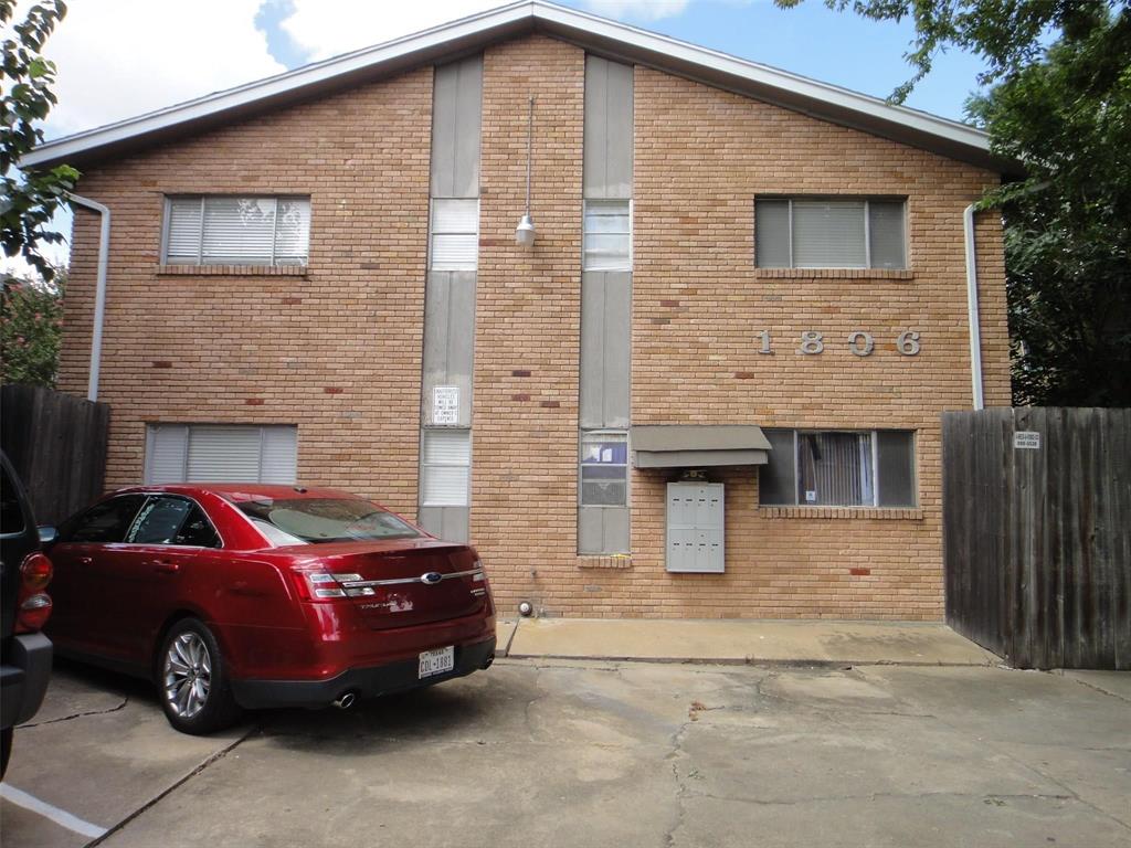 a front view of a house with parking