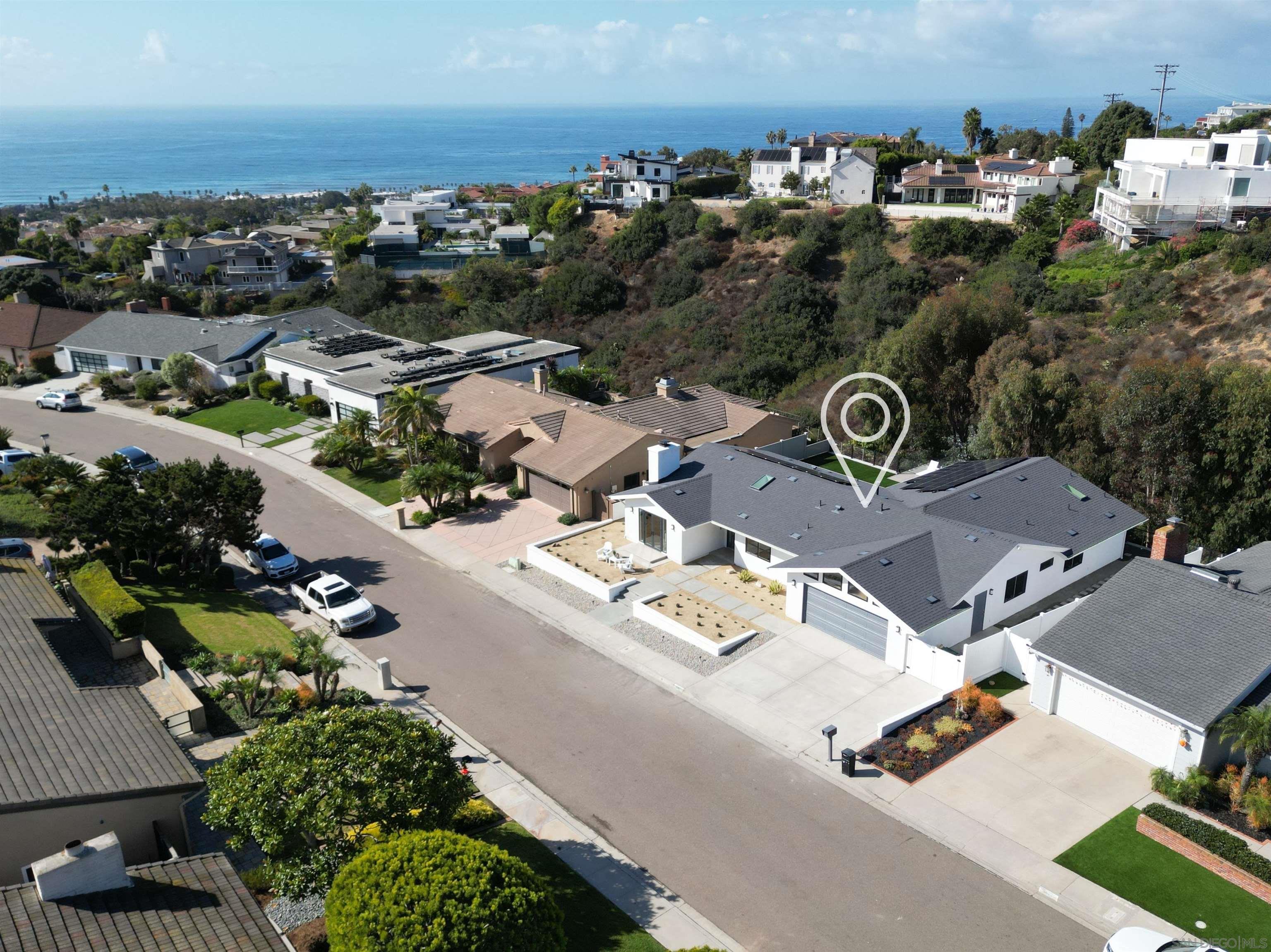 an aerial view of residential house with parking