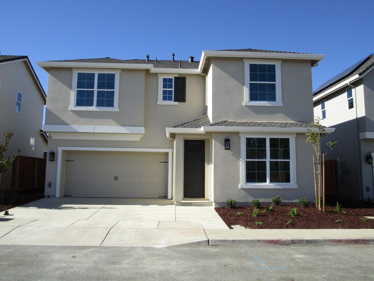 a front view of a house with a garage