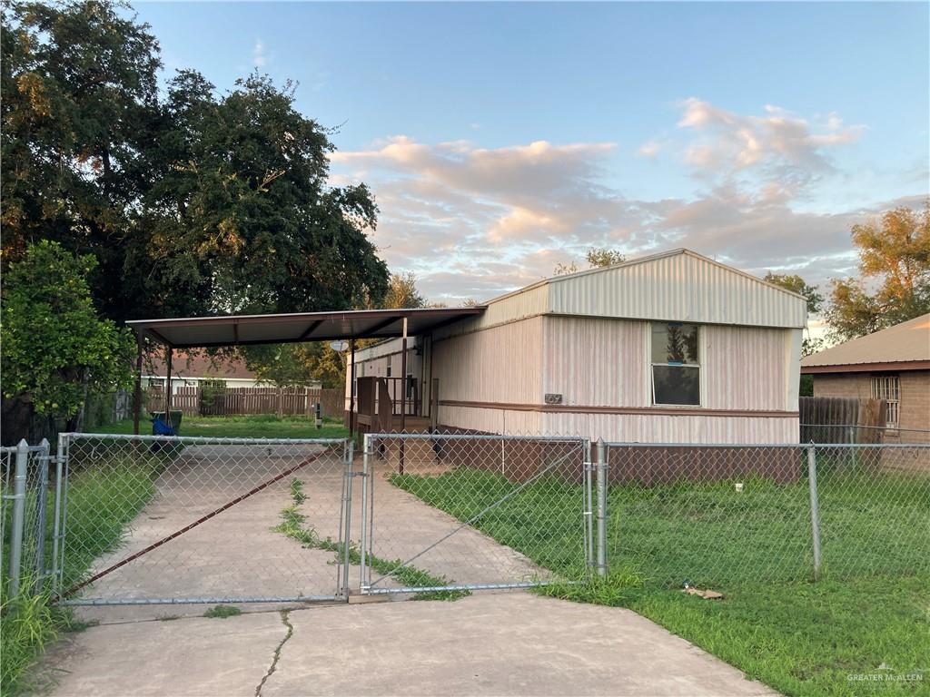 a view of a yard in front view of a house