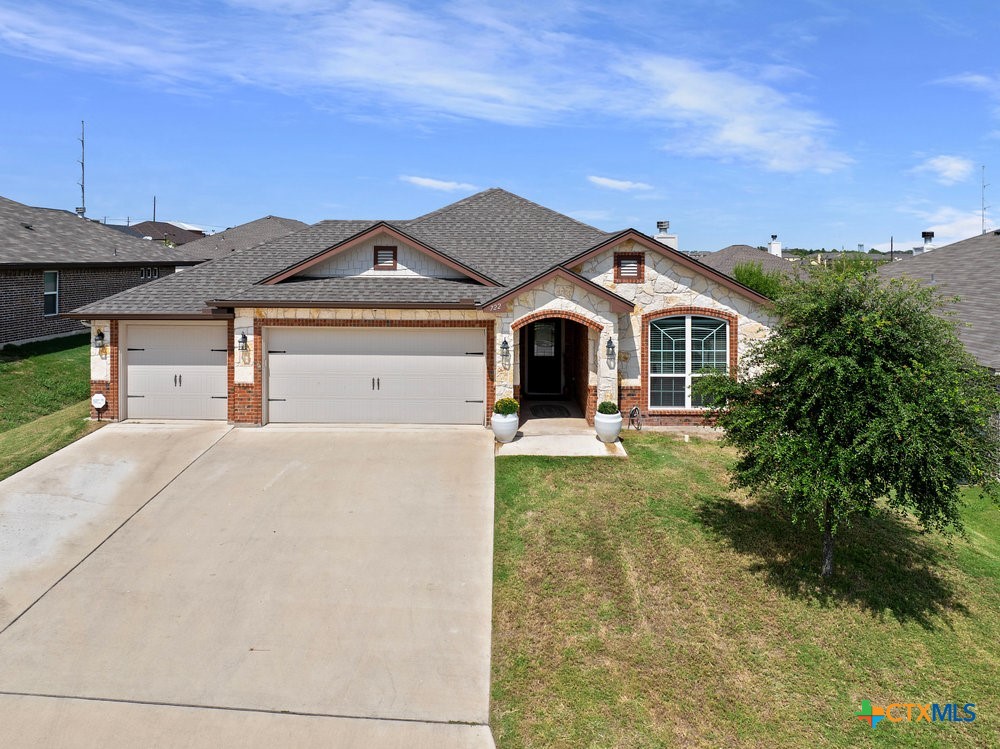 a front view of a house with garden