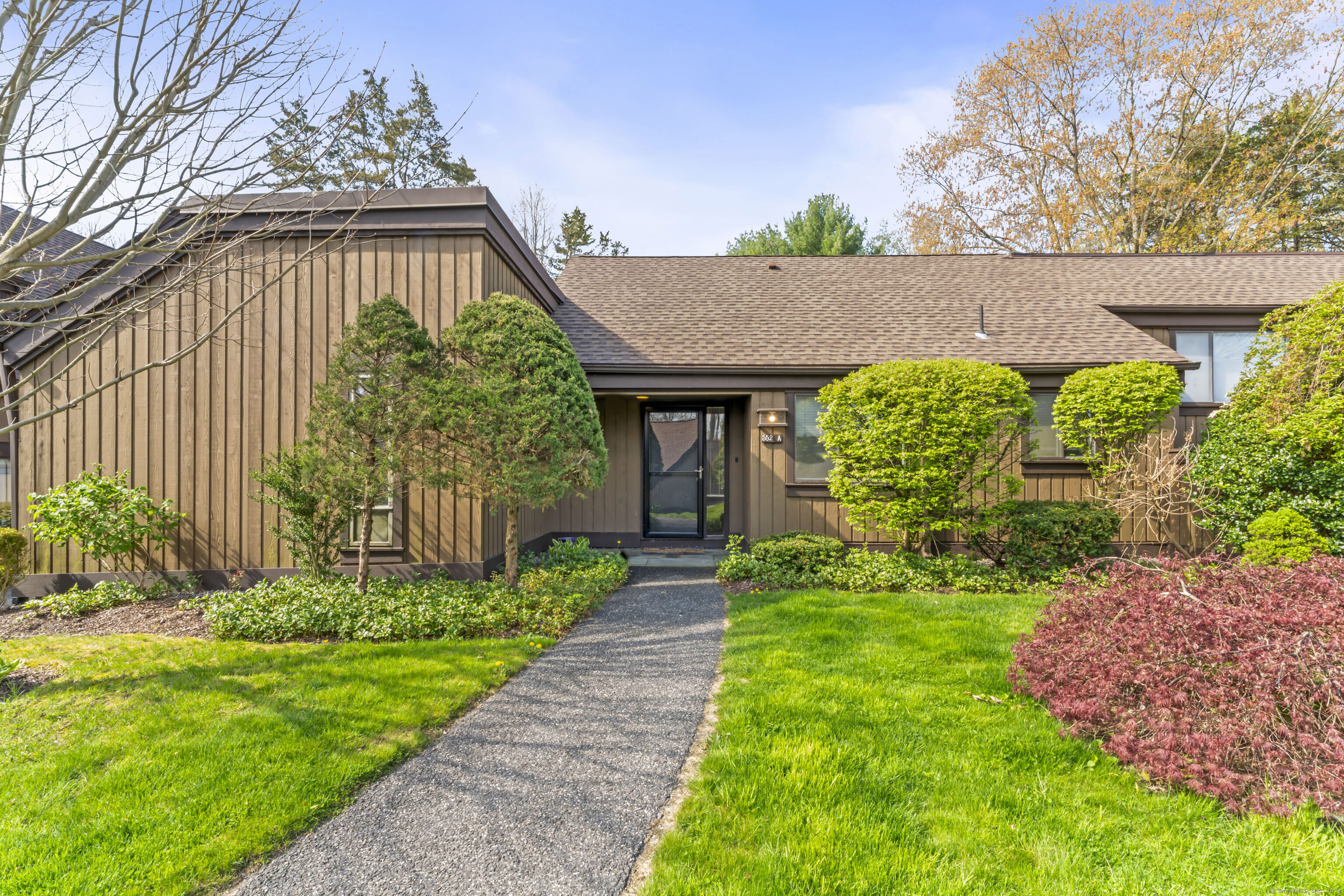 a front view of a house with garden