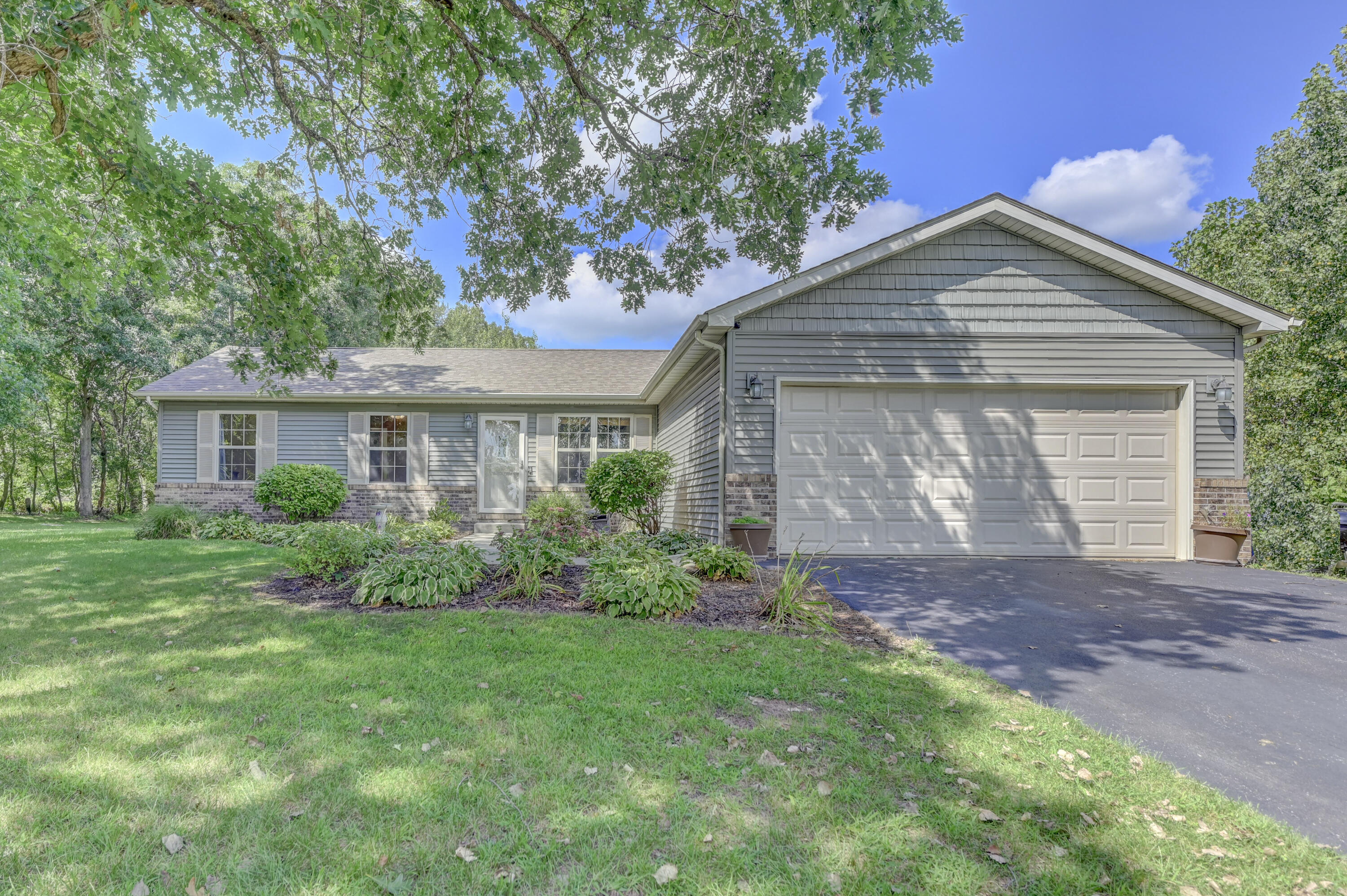 front view of a house with a yard