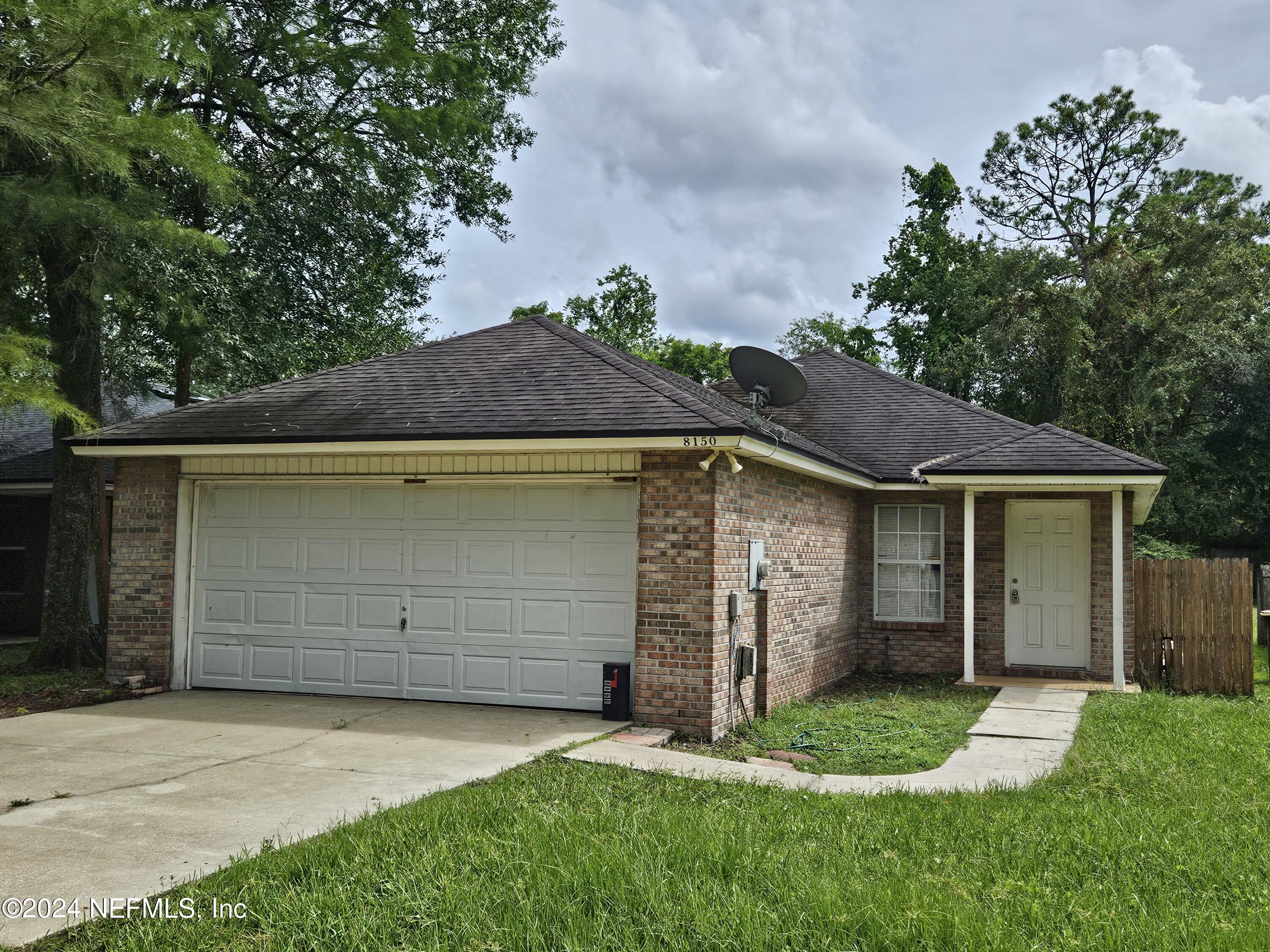 a front view of a house with a garage