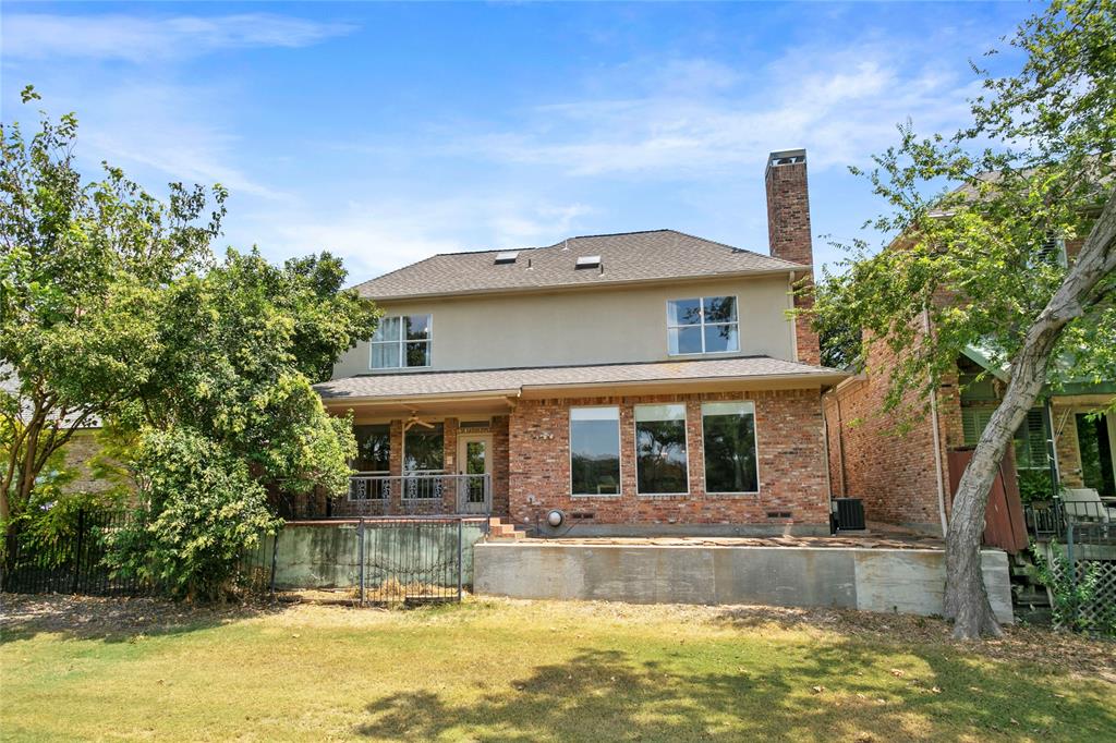 a view of house with a swimming pool