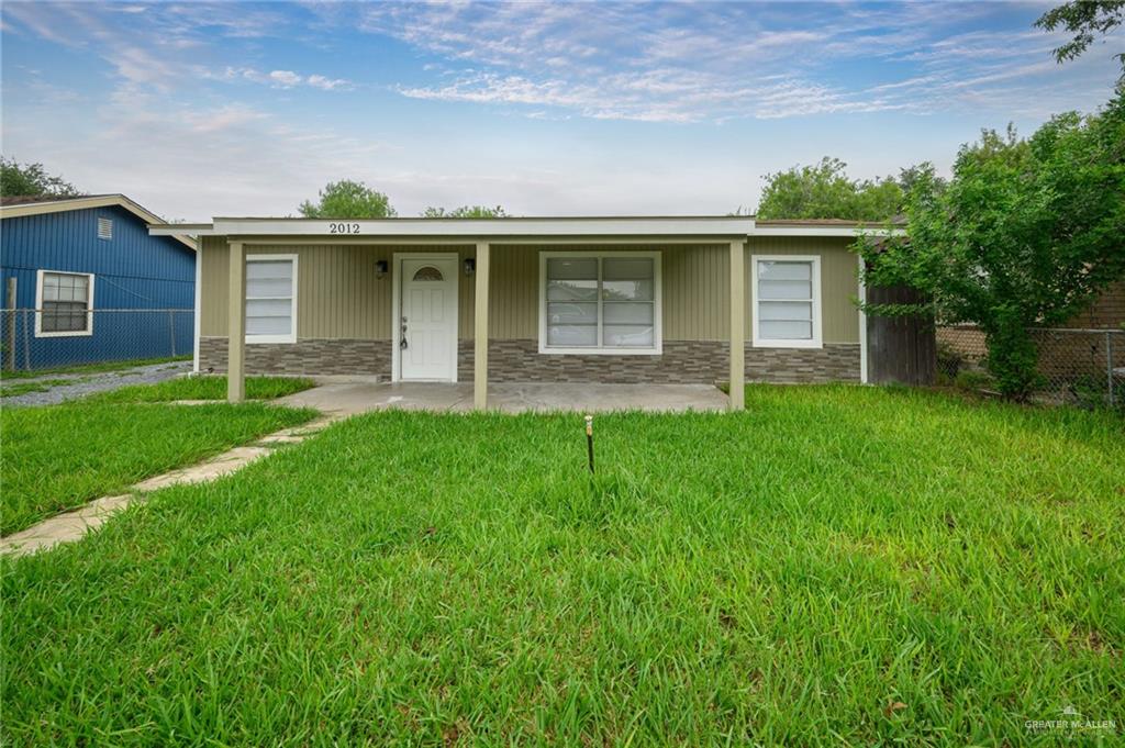 front view of a house with a yard