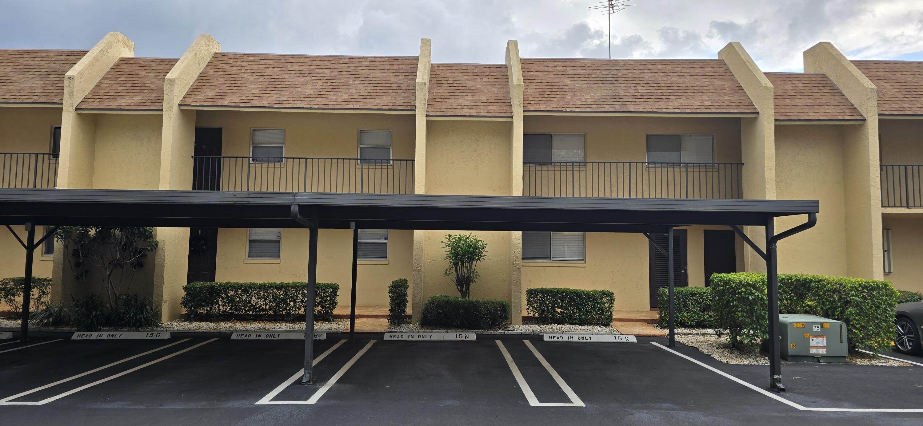 a view of a building with car parked