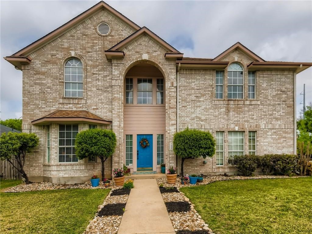 a front view of a house with a yard