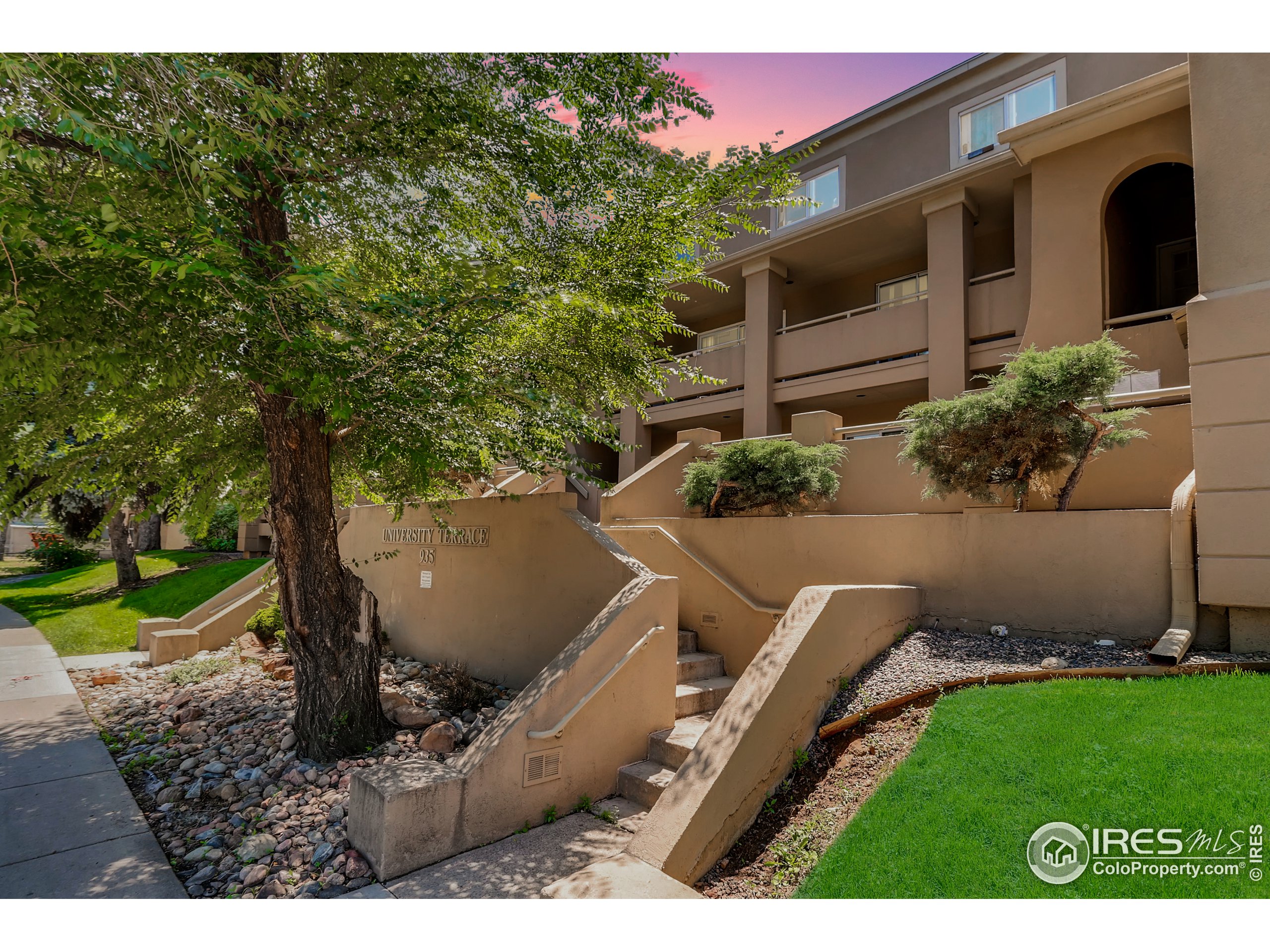 a view of backyard with outdoor seating and green space