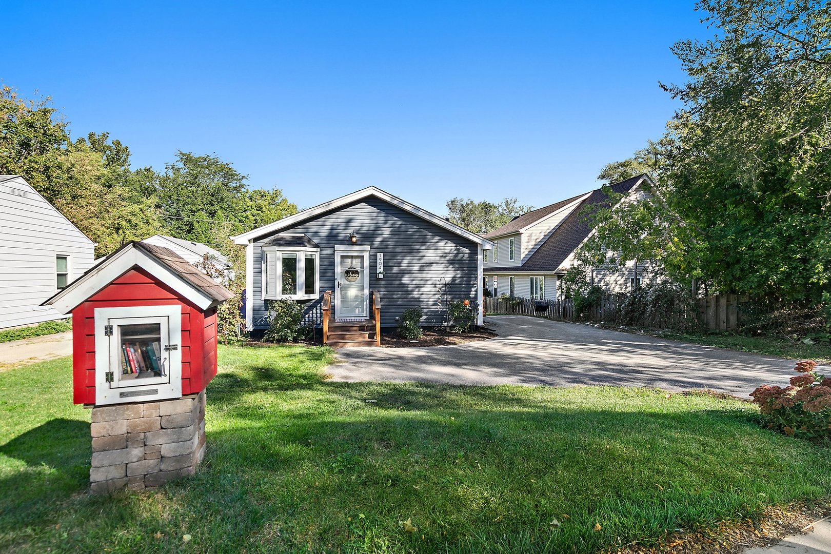 a front view of a house with a yard