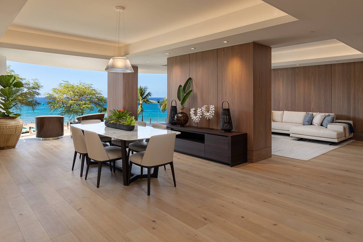 a dining room with furniture and wooden floor