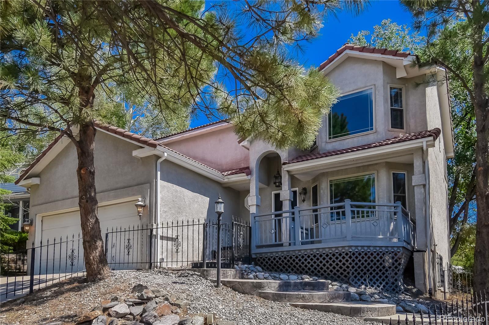 a view of a house with a small yard