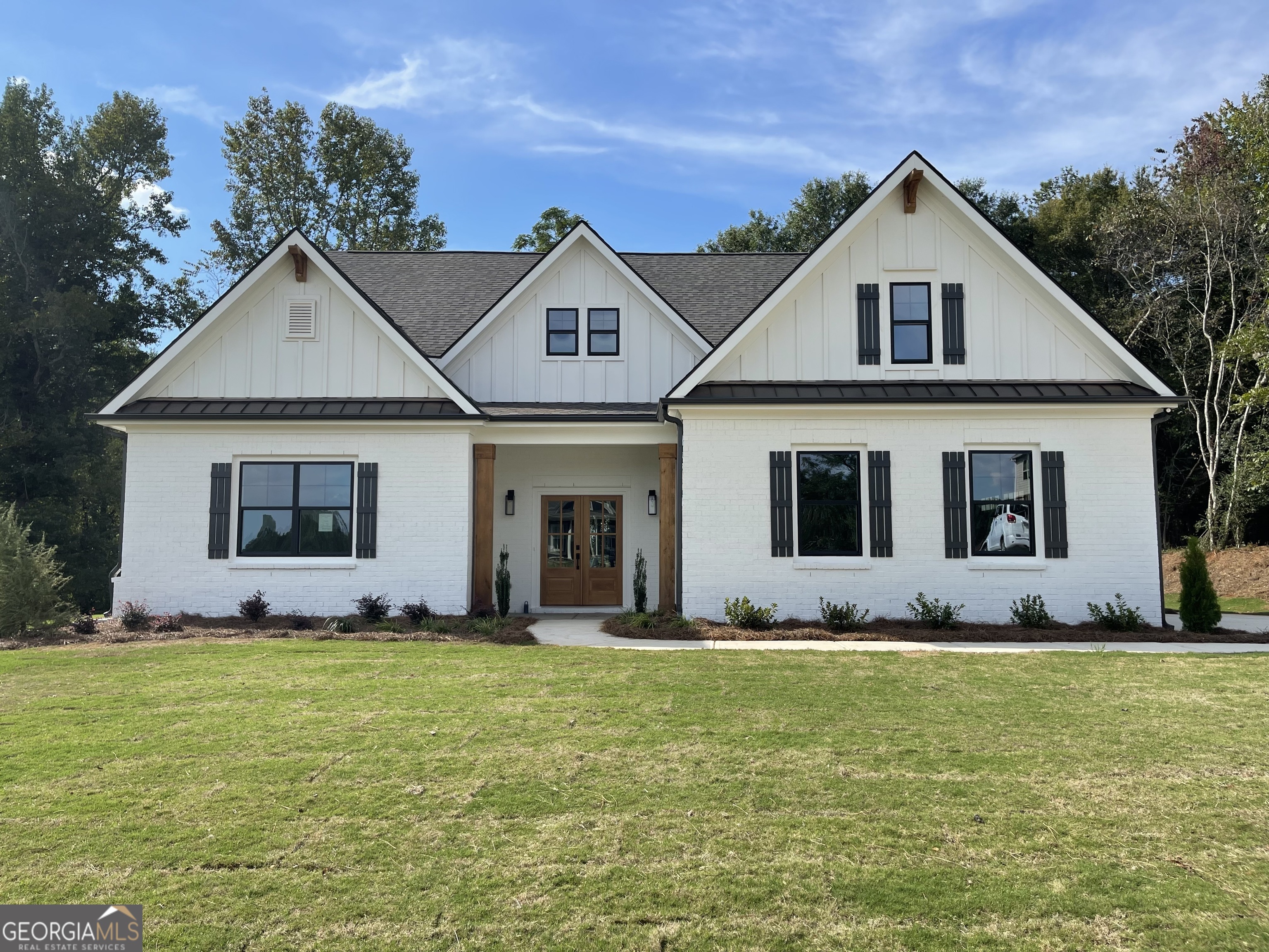 a front view of a house with a yard