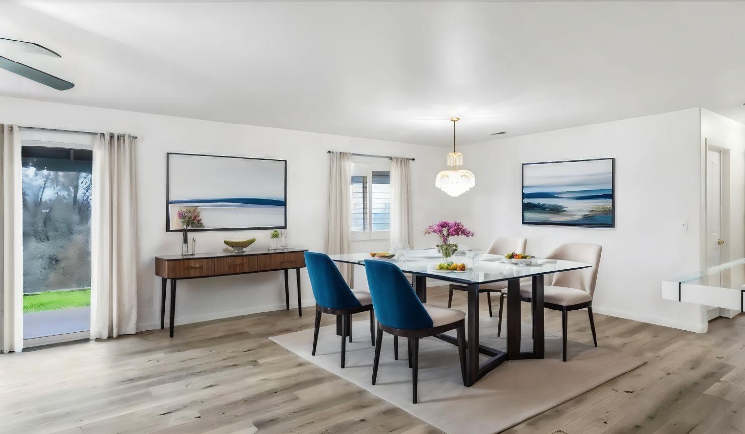 a view of a dining room with furniture and wooden floor