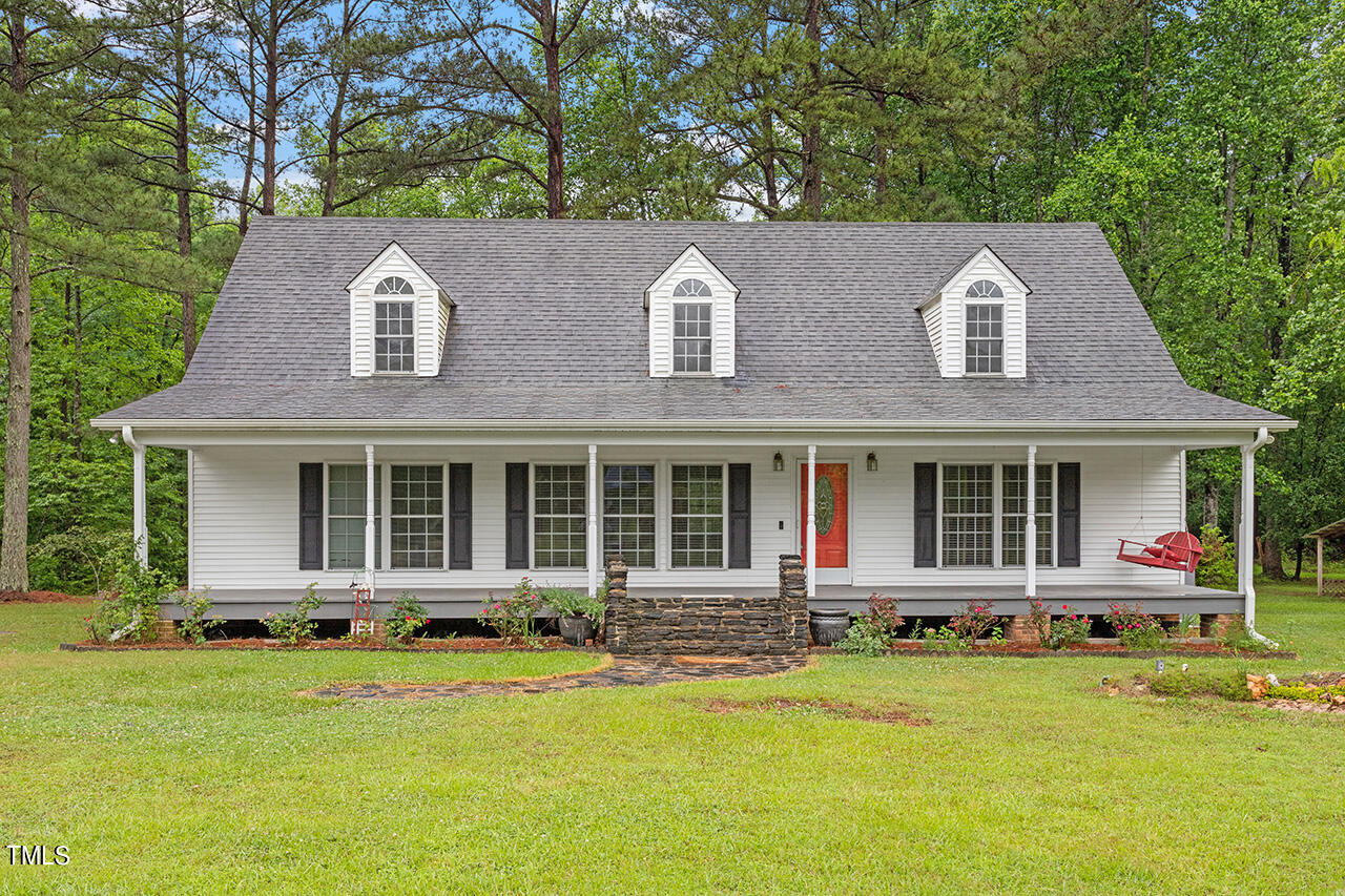 front view of a house with a swimming pool