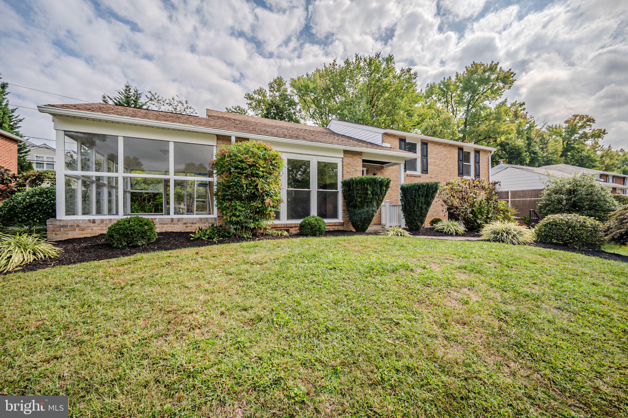 front view of a house with a yard