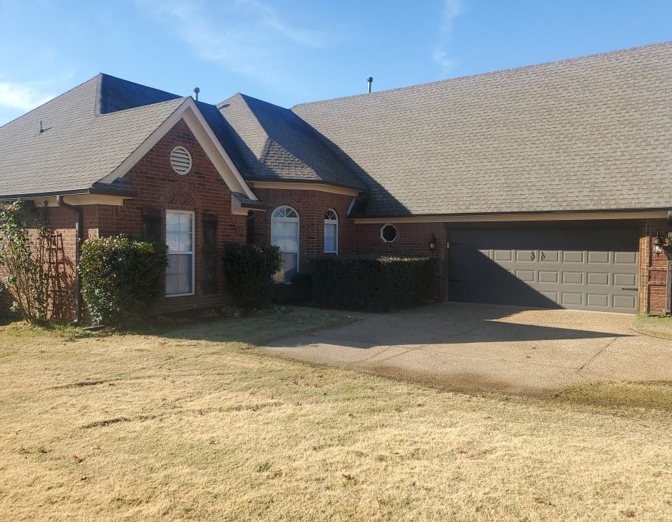 a house with yard in front of it