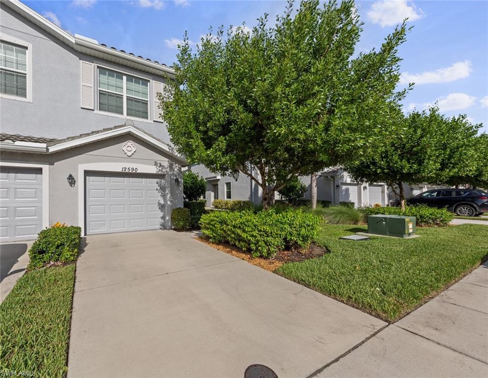 a front view of a house with a yard