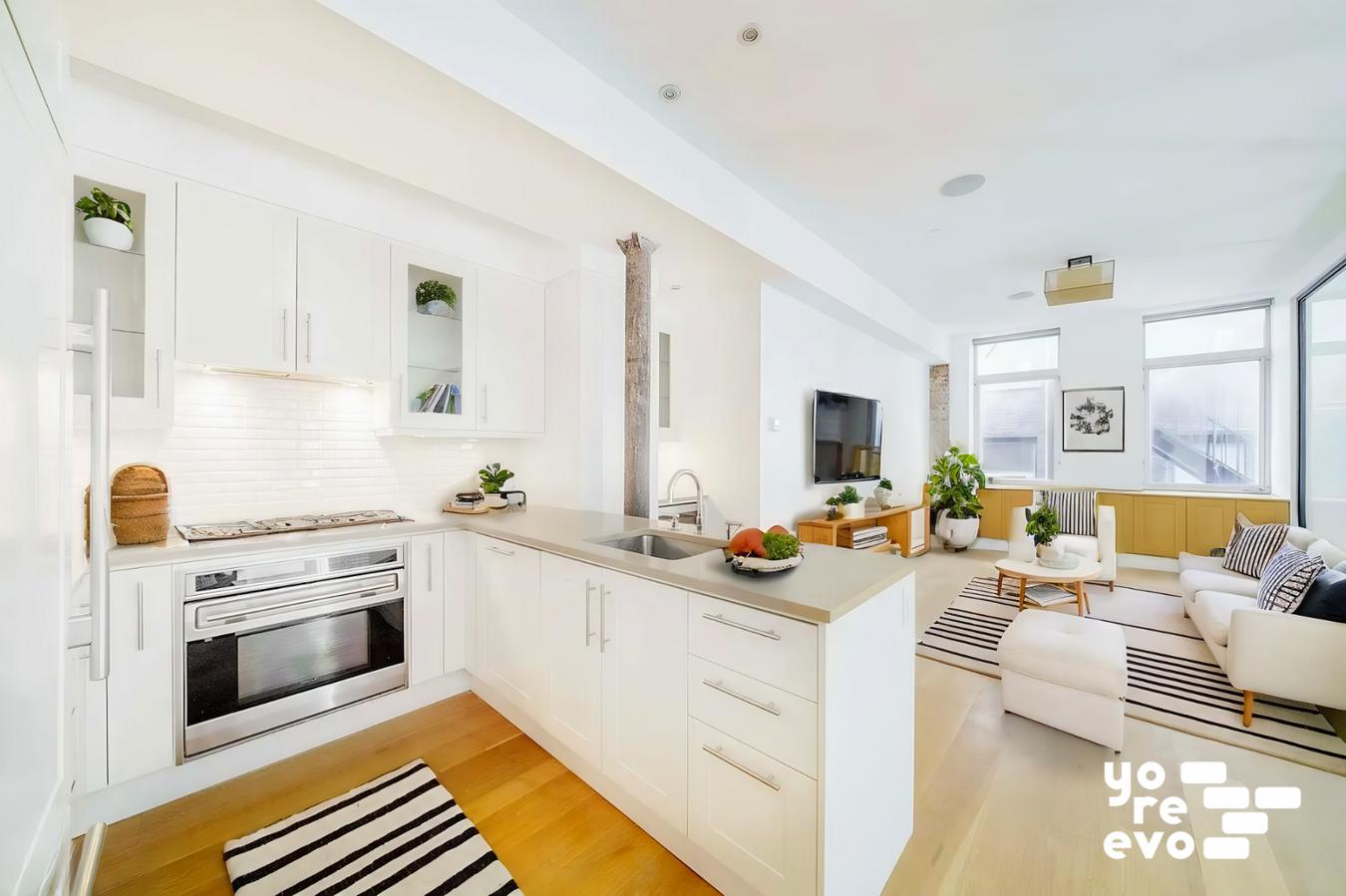 a kitchen with stainless steel appliances a stove a sink and a refrigerator