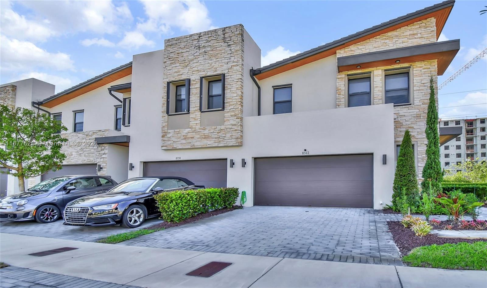 a view of a car parked in front of a house