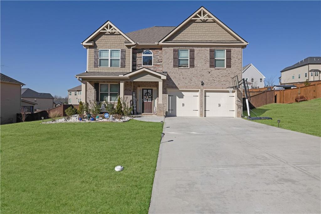 a front view of a house with garden