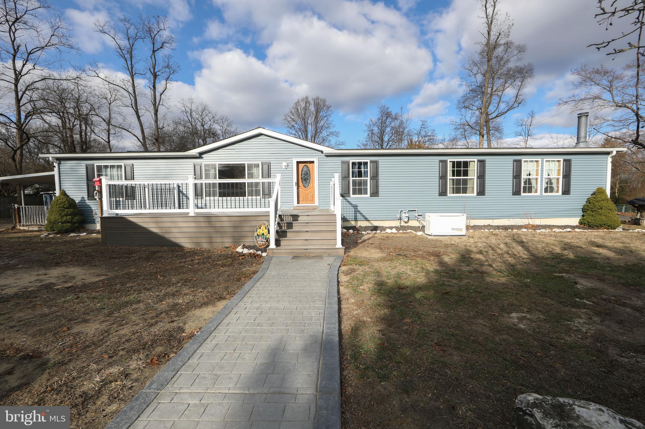 side exteriror w/deck
stamped concrete walkway