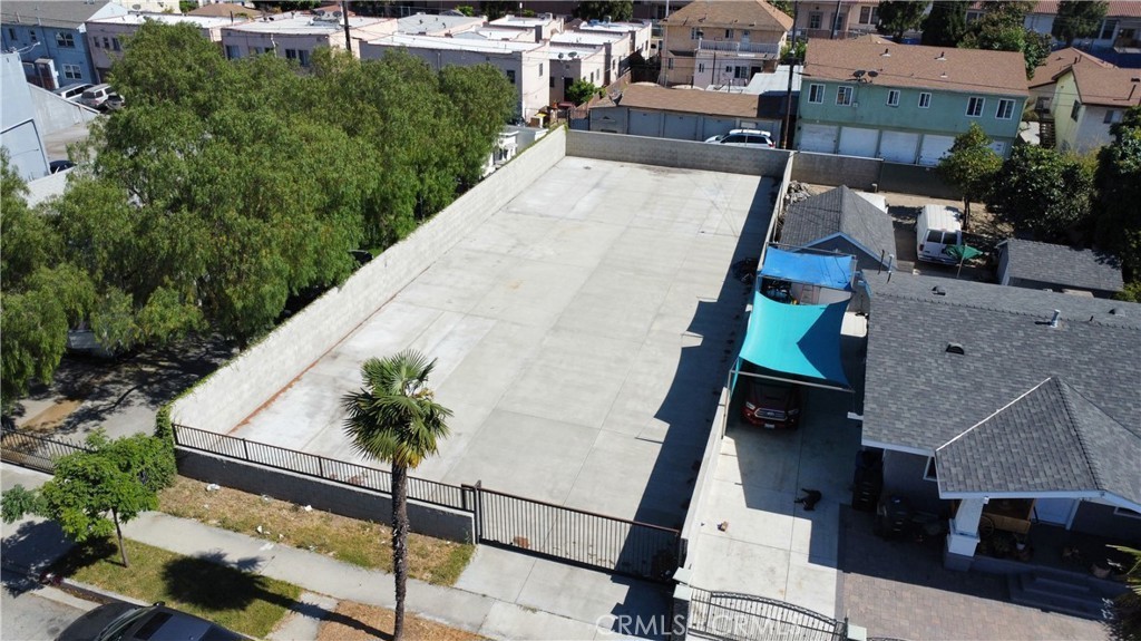 an aerial view of a house with a swimming pool