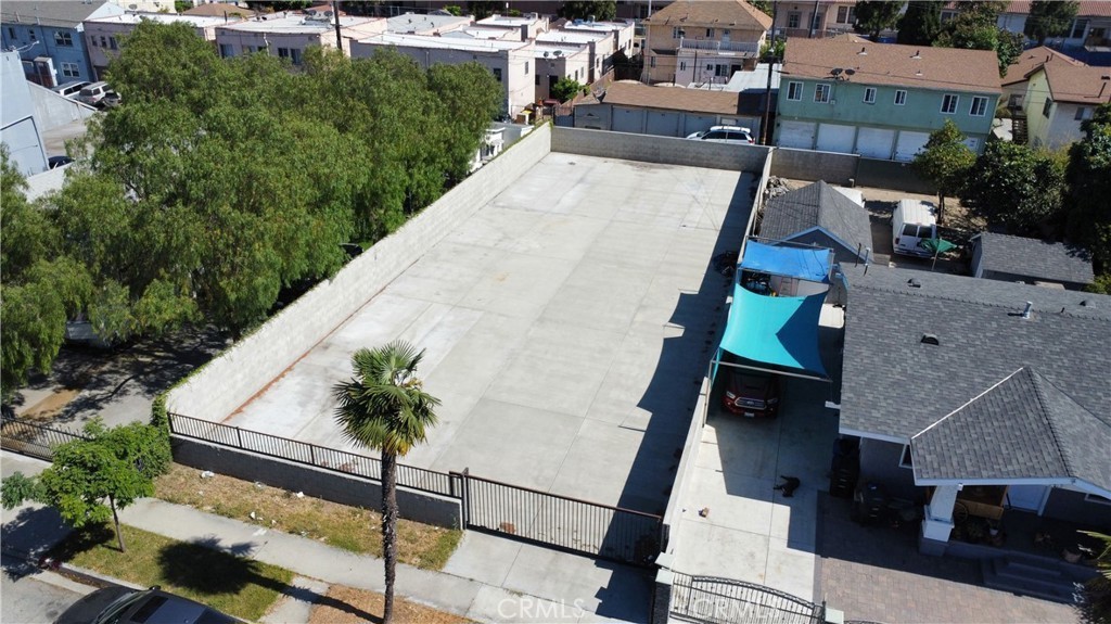 an aerial view of a house with a swimming pool