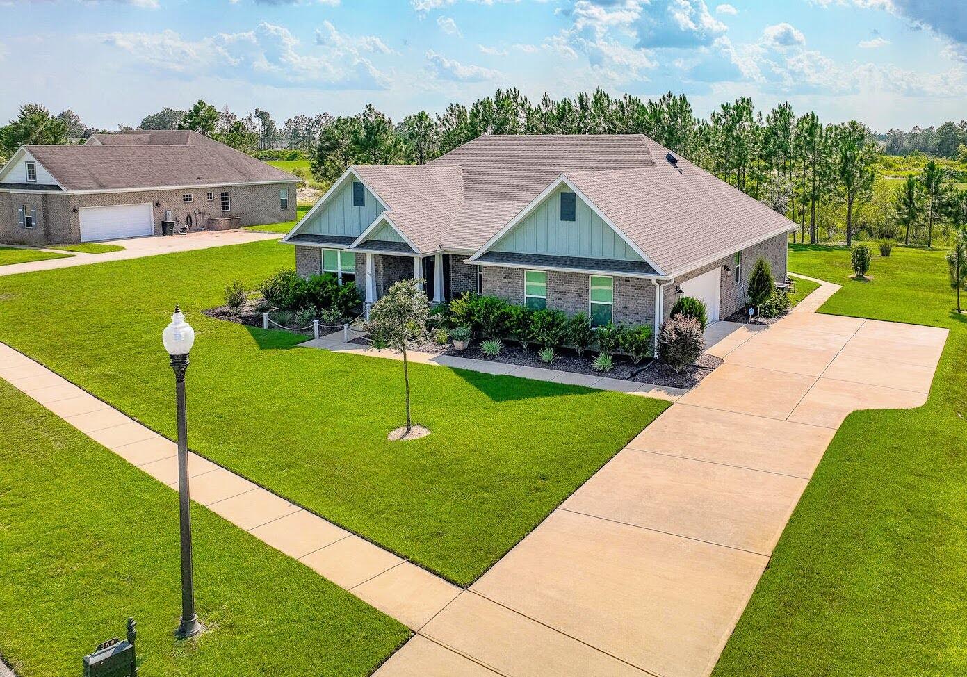 a aerial view of a house with swimming pool