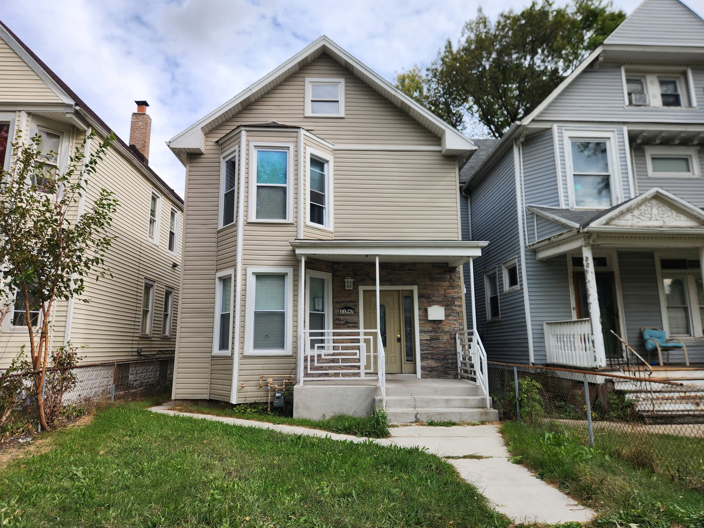 a front view of a house with a yard