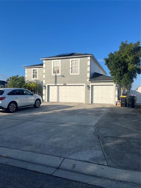 a front view of a house with parking