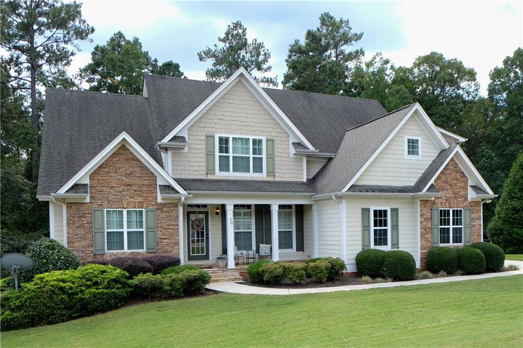 a front view of a house with garden