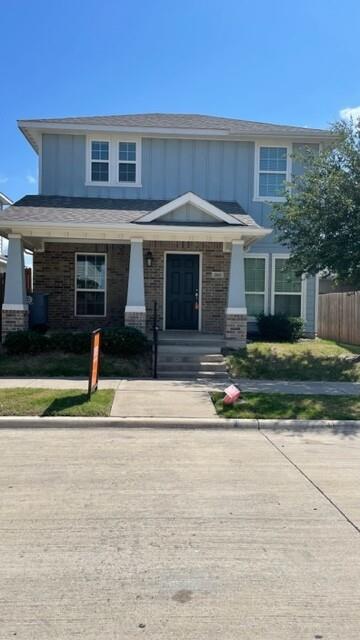 a front view of a house with garage