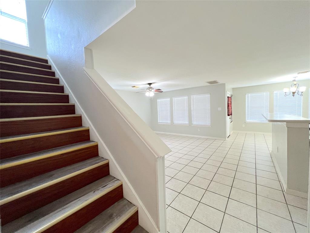 a view of an empty room and wooden floor