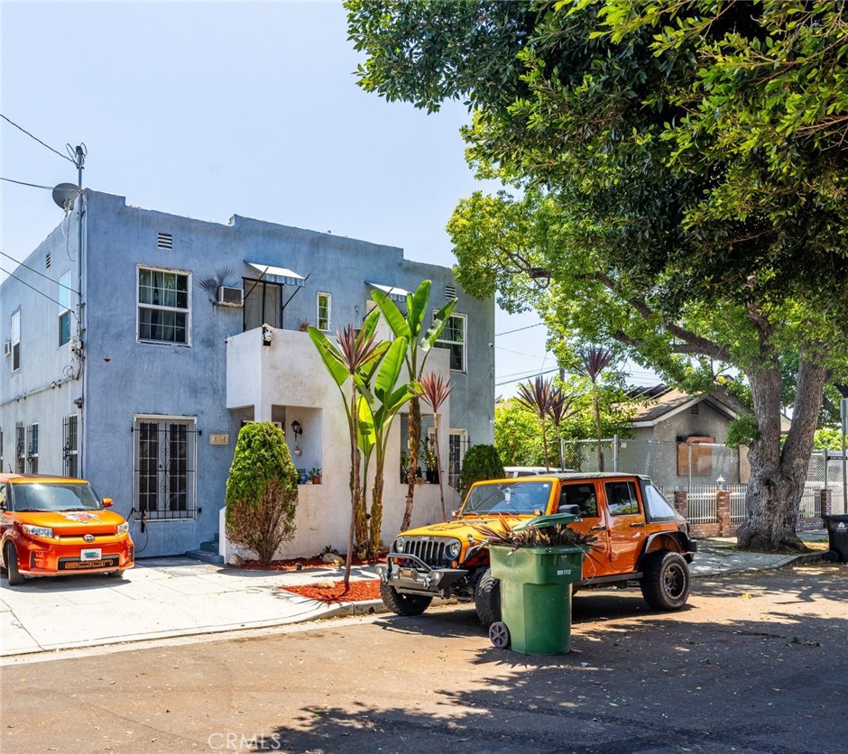 a view of a car parked in front of a building