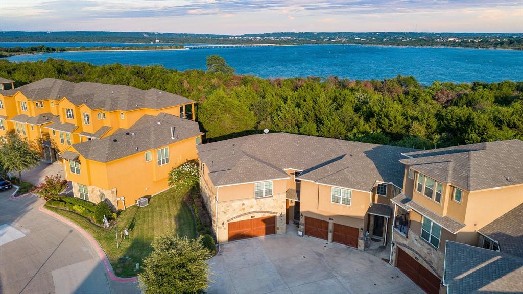 an aerial view of a house with a lake view