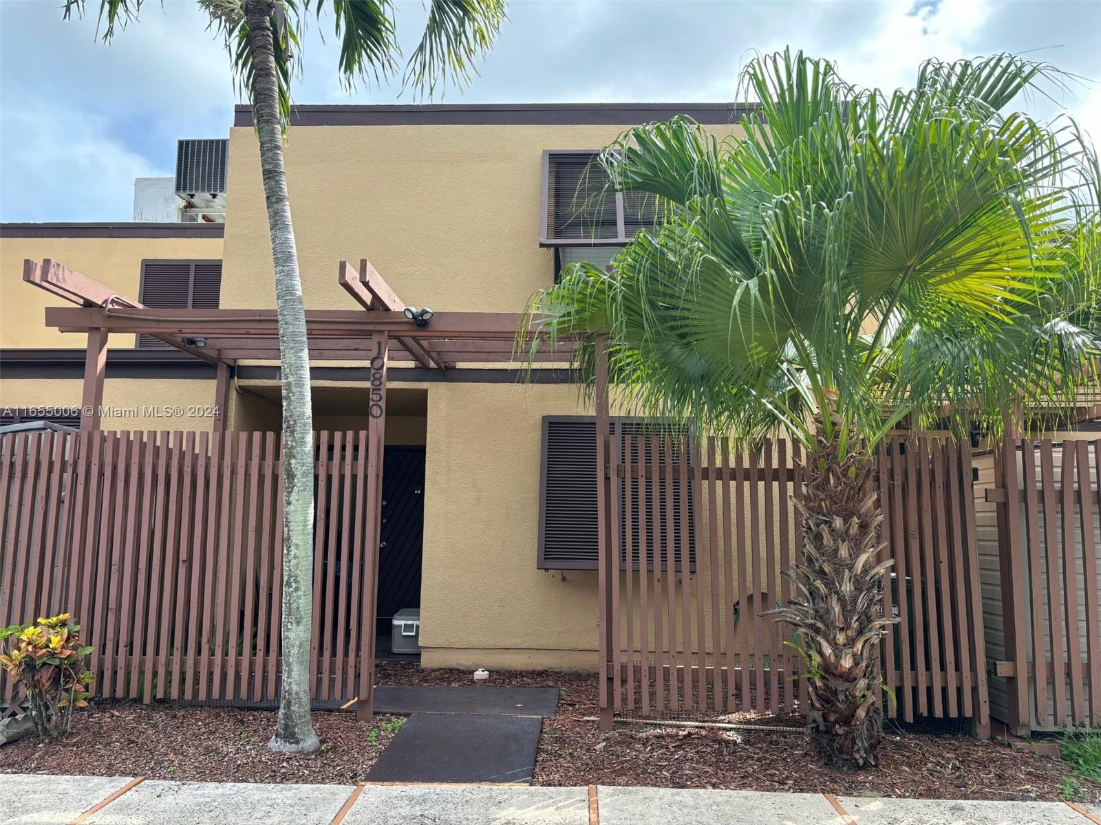 a view of a house with a tree