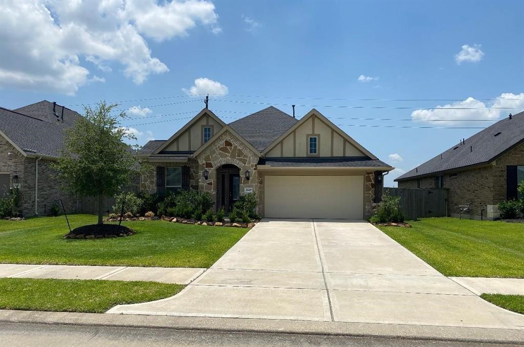 a front view of a house with yard